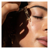 PersonUsing OMOrganics Pure+Calm InfusionRefiningFaceElixir